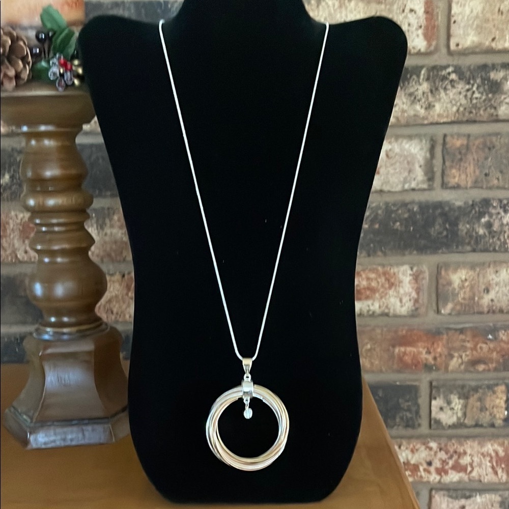 J Lo Silver tone Necklace with multi loop Circular Pendant and rhinestone accent
